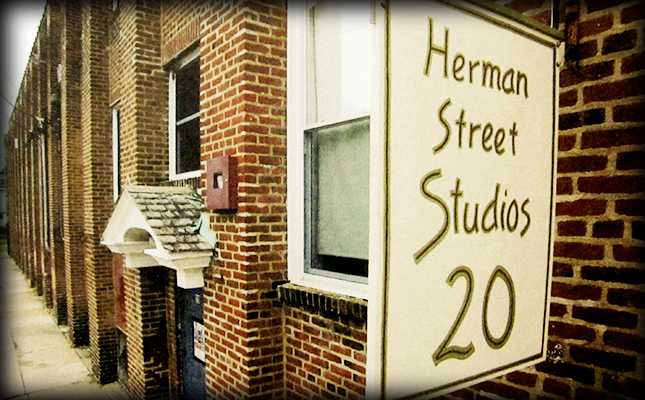 exterior view of Herman St. Studios brick building with business sign